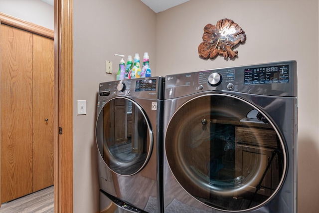 22027 Ethan Ave, Forest Lake, MN 55025 - laundry room with washer and clothes dryer and wood finished floors