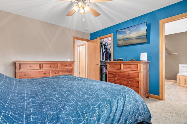22027 Ethan Ave, Forest Lake, MN 55025 - carpeted bedroom featuring a walk in closet and a ceiling fan