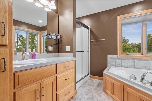 22027 Ethan Ave, Forest Lake, MN 55025 - bathroom with a shower stall, vanity, a jetted tub, and tile patterned floors