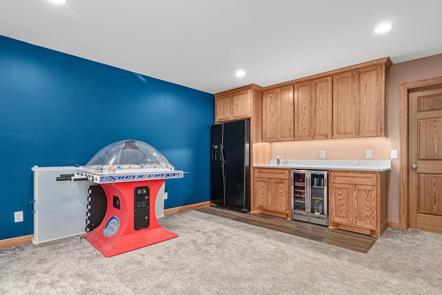 22027 Ethan Ave, Forest Lake, MN 55025 - indoor wet bar with wine cooler, carpet, black refrigerator with ice dispenser, and recessed lighting