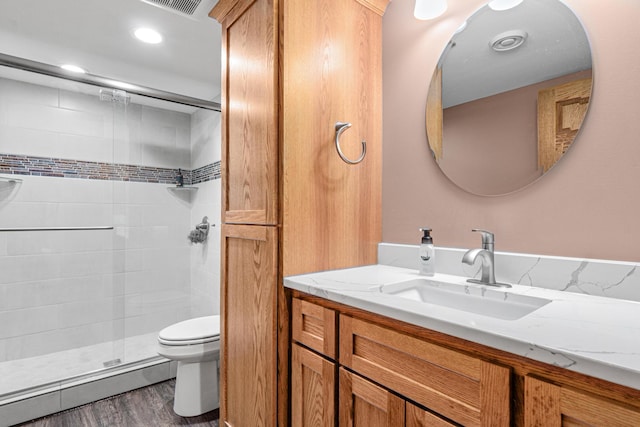 22027 Ethan Ave, Forest Lake, MN 55025 - bathroom featuring a shower stall, vanity, and wood finished floors