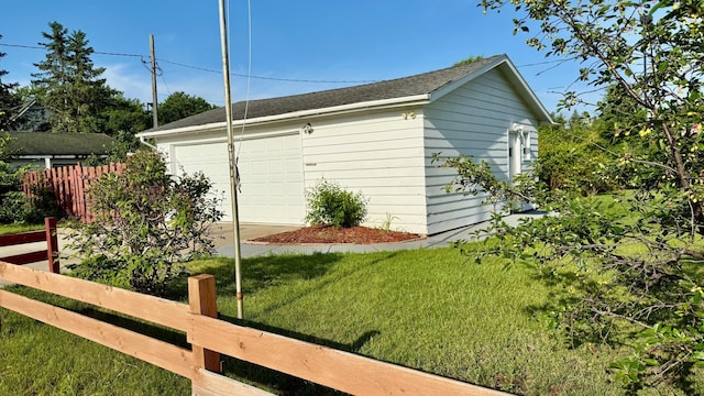 112 4th St E, Park Rapids, MN 56470 - view of side of property with an outdoor structure and roof with shingles