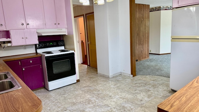 112 4th St E, Park Rapids, MN 56470 - kitchen featuring white appliances, under cabinet range hood, red cabinets, and light carpet