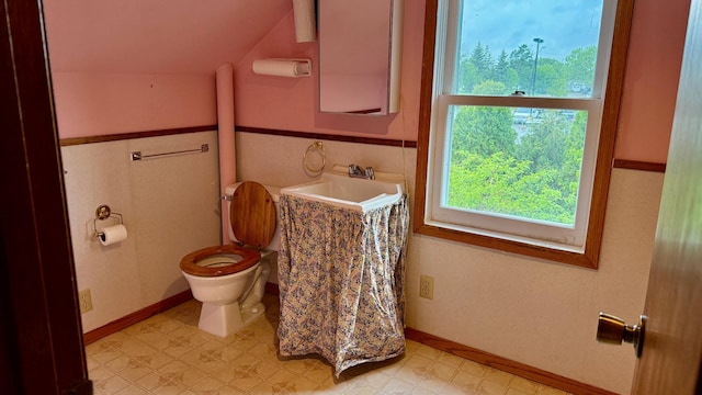 112 4th St E, Park Rapids, MN 56470 - bathroom featuring healthy amount of natural light, lofted ceiling, and tile patterned floors