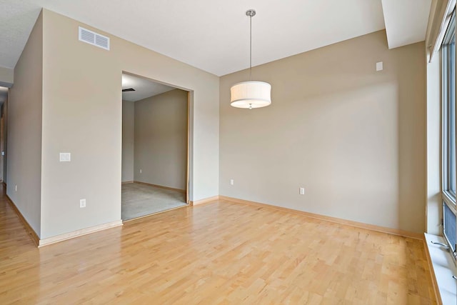 240 Spring St Unit 413, Saint Paul, MN 55102 - empty room with wood finished floors and baseboards