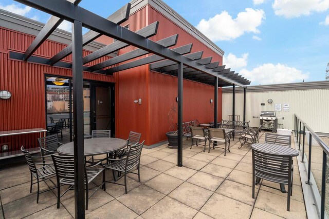 240 Spring St Unit 413, Saint Paul, MN 55102 - view of patio with outdoor dining area, a pergola, and a grill