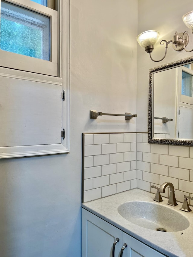 410 10th St SW, Willmar, MN 56201 - bathroom featuring decorative backsplash and vanity