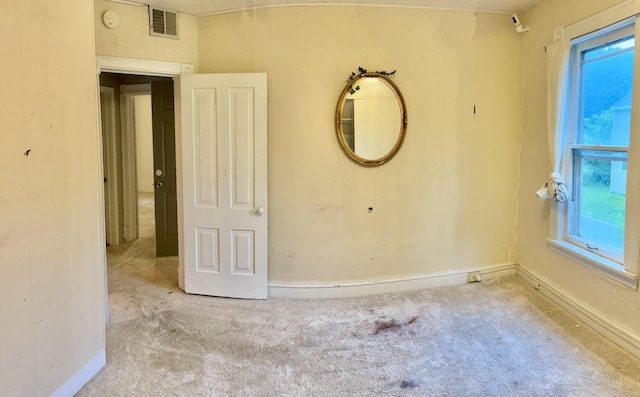 410 10th St SW, Willmar, MN 56201 - spare room featuring carpet floors and a smoke detector