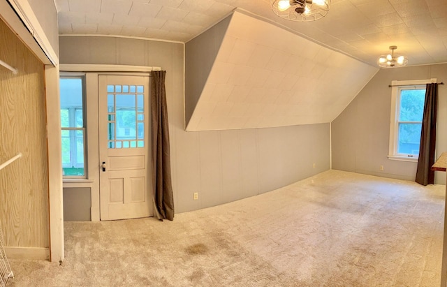 410 10th St SW, Willmar, MN 56201 - bonus room with carpet floors, a chandelier, and lofted ceiling