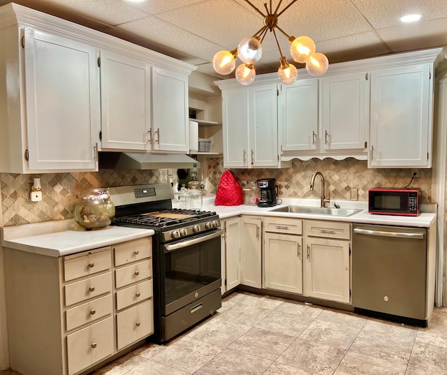 410 10th St SW, Willmar, MN 56201 - kitchen with stainless steel appliances, open shelves, light countertops, and tasteful backsplash