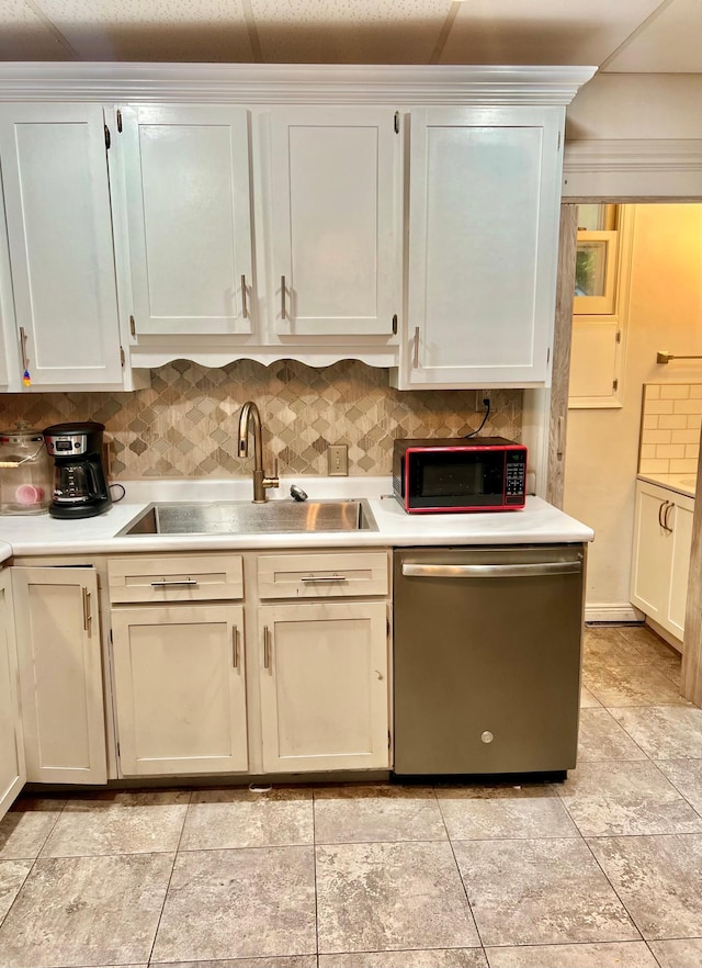 410 10th St SW, Willmar, MN 56201 - kitchen with stainless steel dishwasher, light countertops, and decorative backsplash
