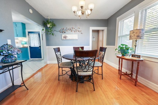 938 38th Ave N, Saint Cloud, MN 56303 - dining area featuring a chandelier and light wood-style flooring