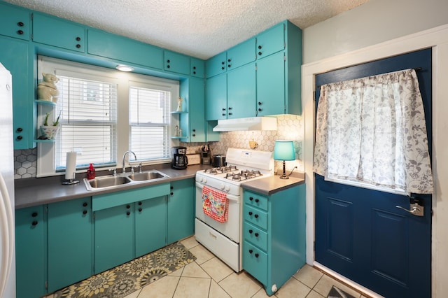 938 38th Ave N, Saint Cloud, MN 56303 - kitchen featuring white range with gas cooktop, under cabinet range hood, tasteful backsplash, a textured ceiling, and light tile patterned flooring