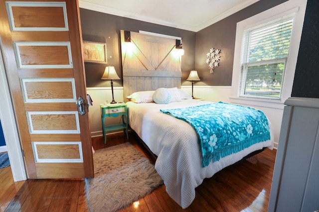 938 38th Ave N, Saint Cloud, MN 56303 - bedroom with ornamental molding, hardwood / wood-style flooring, and wainscoting