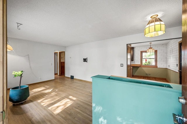 6121 Trinity Dr NE, Fridley, MN 55432 - game room featuring wood finished floors and a textured ceiling