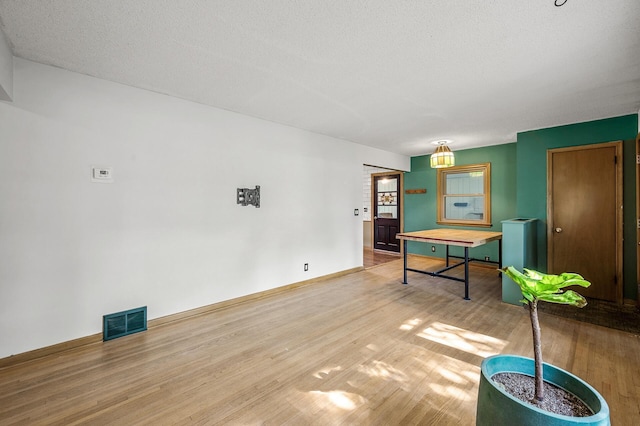 6121 Trinity Dr NE, Fridley, MN 55432 - recreation room featuring wood finished floors and baseboards