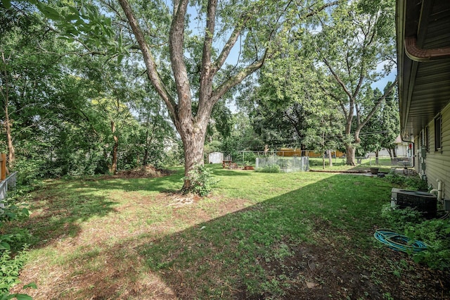 6121 Trinity Dr NE, Fridley, MN 55432 - view of yard with a storage shed