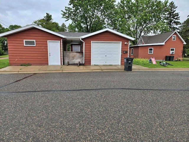 607 Riverside Ave, Park Rapids, MN 56470 - single story home featuring a garage and a shingled roof