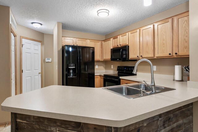 6226 Maclynn Ave NE, Otsego, MN 55301 - kitchen featuring black appliances, light brown cabinetry, a peninsula, light countertops, and a textured ceiling