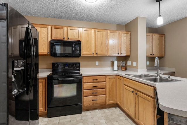 6226 Maclynn Ave NE, Otsego, MN 55301 - kitchen featuring black appliances, light countertops, a textured ceiling, light brown cabinets, and a peninsula
