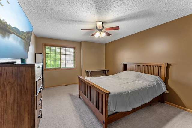6226 Maclynn Ave NE, Otsego, MN 55301 - bedroom featuring light carpet, a textured ceiling, and ceiling fan