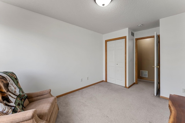 6226 Maclynn Ave NE, Otsego, MN 55301 - sitting room featuring light colored carpet and a textured ceiling