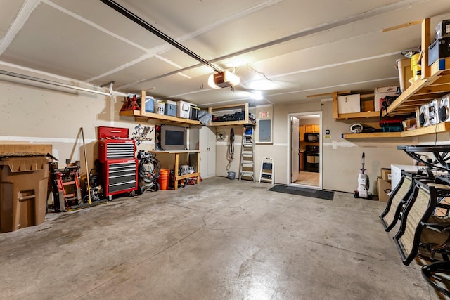 6226 Maclynn Ave NE, Otsego, MN 55301 - garage featuring electric panel, a workshop area, and a garage door opener