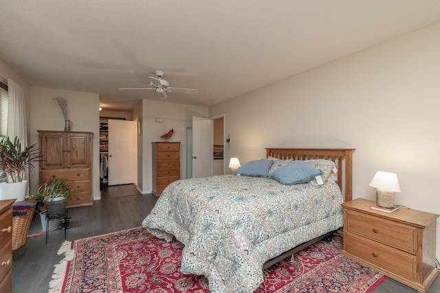 1163 Edgcumbe Rd Unit 1163, Saint Paul, MN 55105 - bedroom featuring dark wood-type flooring, a ceiling fan, a closet, and a walk in closet