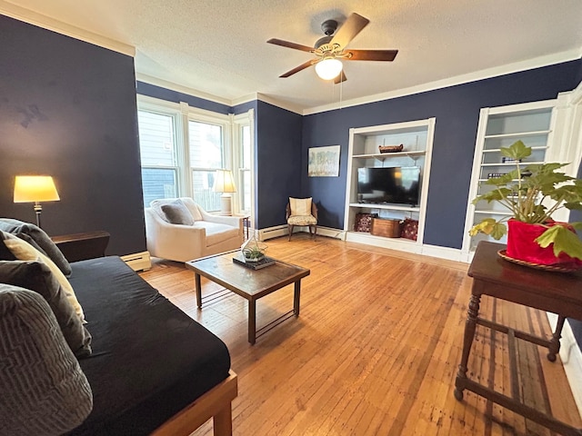 3128 Portland Ave, Minneapolis, MN 55407 - living room featuring a textured ceiling, built in shelves, ceiling fan, light wood-type flooring, and baseboard heating