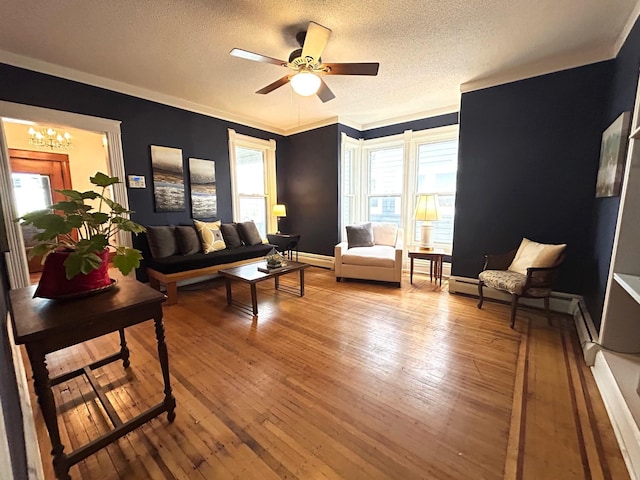 3128 Portland Ave, Minneapolis, MN 55407 - living room with a textured ceiling, a baseboard radiator, a chandelier, light wood-style flooring, and a ceiling fan