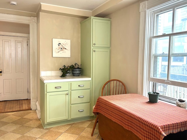 3128 Portland Ave, Minneapolis, MN 55407 - dining room featuring plenty of natural light, crown molding, and light tile patterned floors