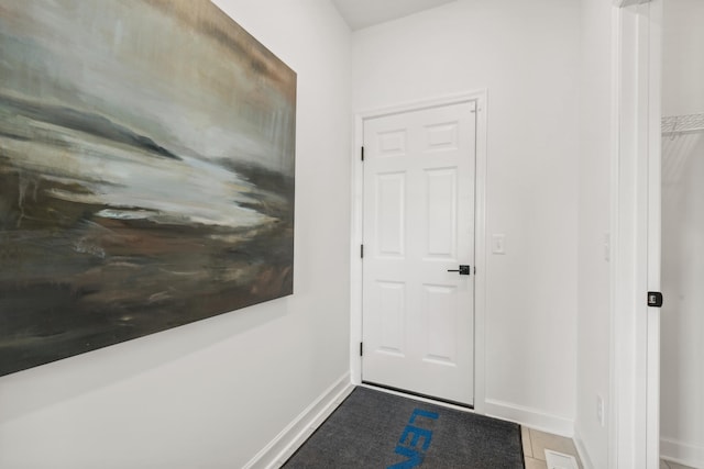 5890 Rathbun Ave NE, Otsego, MN 55374 - doorway to outside featuring baseboards and tile patterned floors