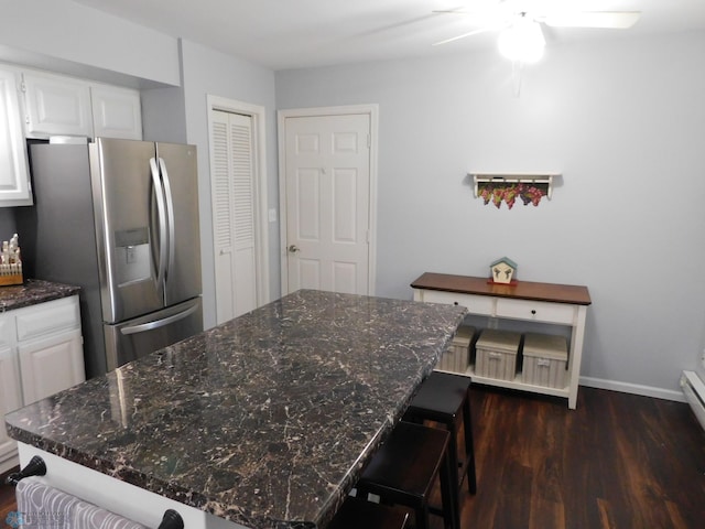 2524 25th Ave S, Fargo, ND 58103 - kitchen with stainless steel fridge with ice dispenser, dark wood finished floors, a kitchen island, a ceiling fan, and white cabinets