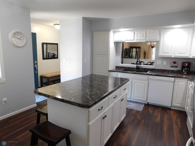 2524 25th Ave S, Fargo, ND 58103 - kitchen featuring dishwasher, dark wood-style floors, a breakfast bar area, and white cabinetry