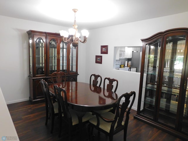 2524 25th Ave S, Fargo, ND 58103 - dining area with a chandelier and dark wood-style flooring