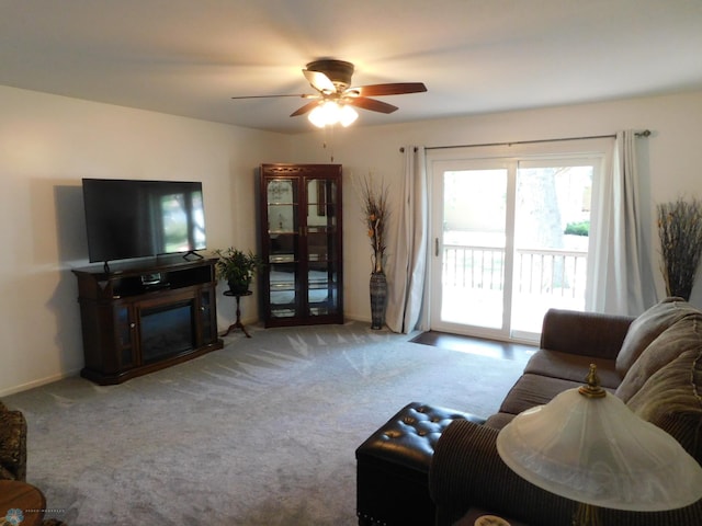 2524 25th Ave S, Fargo, ND 58103 - living room featuring a ceiling fan, carpet flooring, and a glass covered fireplace