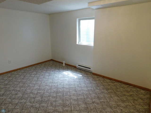 2524 25th Ave S, Fargo, ND 58103 - carpeted spare room featuring a baseboard radiator and baseboards