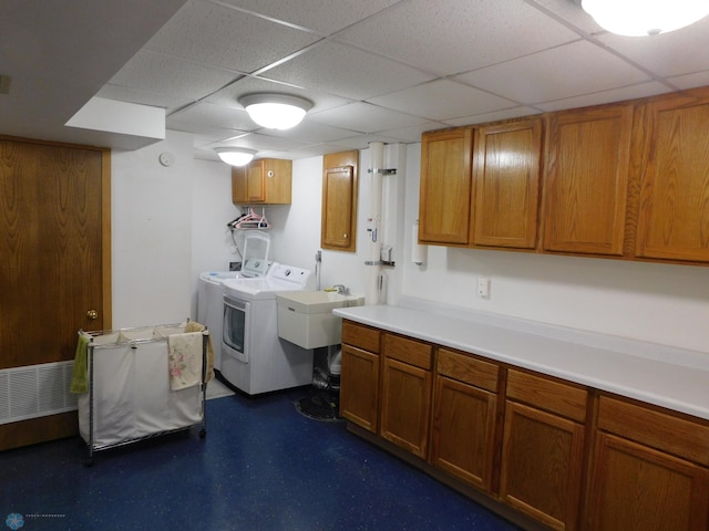 2524 25th Ave S, Fargo, ND 58103 - laundry area featuring cabinet space and washing machine and dryer