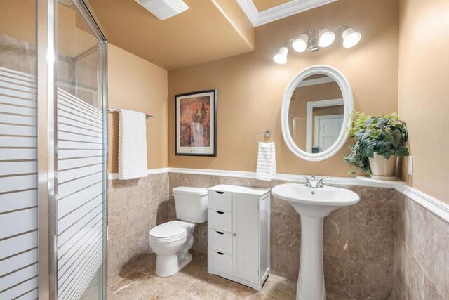 5390 157th St N, Hugo, MN 55038 - full bathroom with tile walls, a wainscoted wall, a shower stall, and tile patterned floors