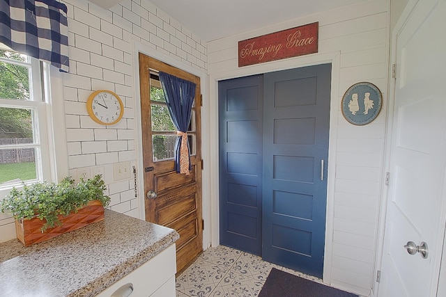 1016 26th Ave N, Saint Cloud, MN 56303 - foyer entrance featuring healthy amount of natural light and light tile patterned floors