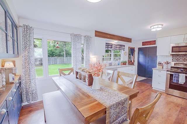 1016 26th Ave N, Saint Cloud, MN 56303 - dining space featuring light wood-style floors