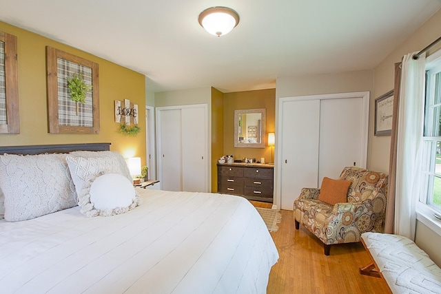 1016 26th Ave N, Saint Cloud, MN 56303 - bedroom featuring multiple closets and light wood finished floors