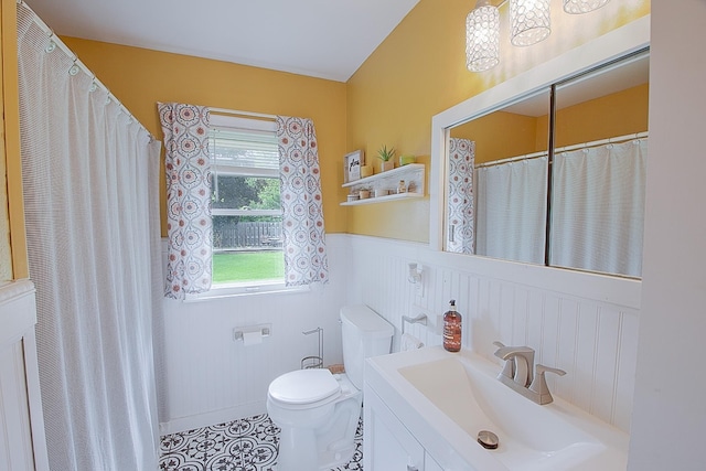 1016 26th Ave N, Saint Cloud, MN 56303 - bathroom featuring a wainscoted wall, vanity, and tile patterned flooring