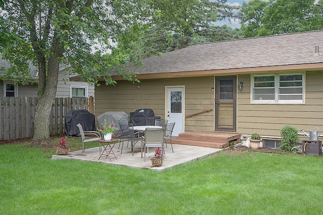 1016 26th Ave N, Saint Cloud, MN 56303 - rear view of house with a patio and a shingled roof