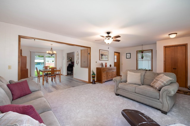 1704 Fair St, Mankato, MN 56001 - living area featuring a chandelier, ceiling fan, and light colored carpet
