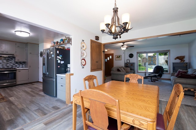 1704 Fair St, Mankato, MN 56001 - dining area featuring a chandelier, light wood finished floors, and ceiling fan