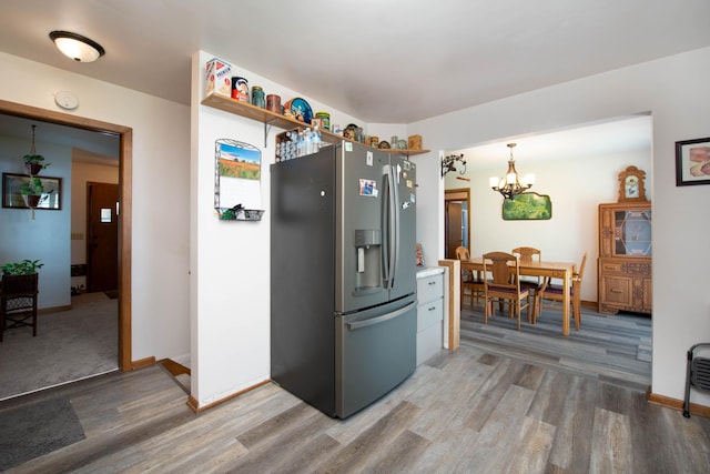 1704 Fair St, Mankato, MN 56001 - kitchen featuring stainless steel refrigerator with ice dispenser, light wood finished floors, and a chandelier