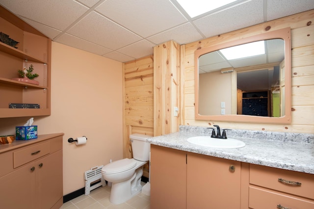 1704 Fair St, Mankato, MN 56001 - bathroom featuring a drop ceiling, vanity, tile patterned flooring, and baseboard heating
