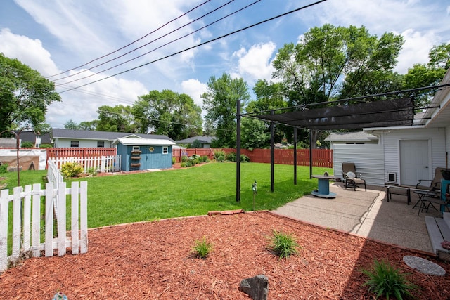 1704 Fair St, Mankato, MN 56001 - fenced backyard featuring a patio area and a storage shed
