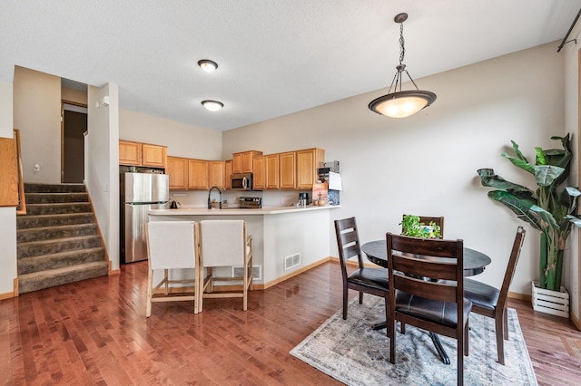 20060 Heritage Dr, Lakeville, MN 55044 - dining area featuring wood finished floors and stairway